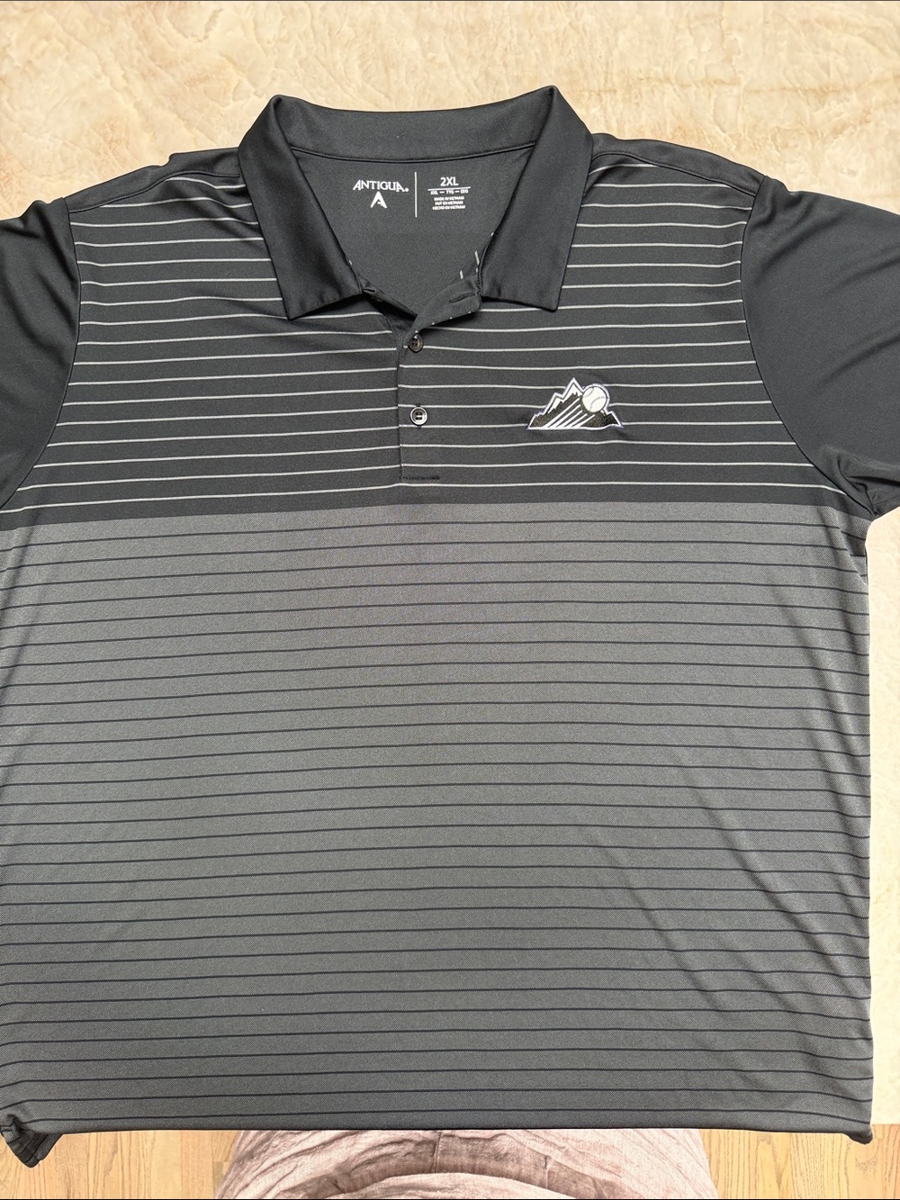 Antigua Men’s Black Colorado Rockies Striped Polo Shirt